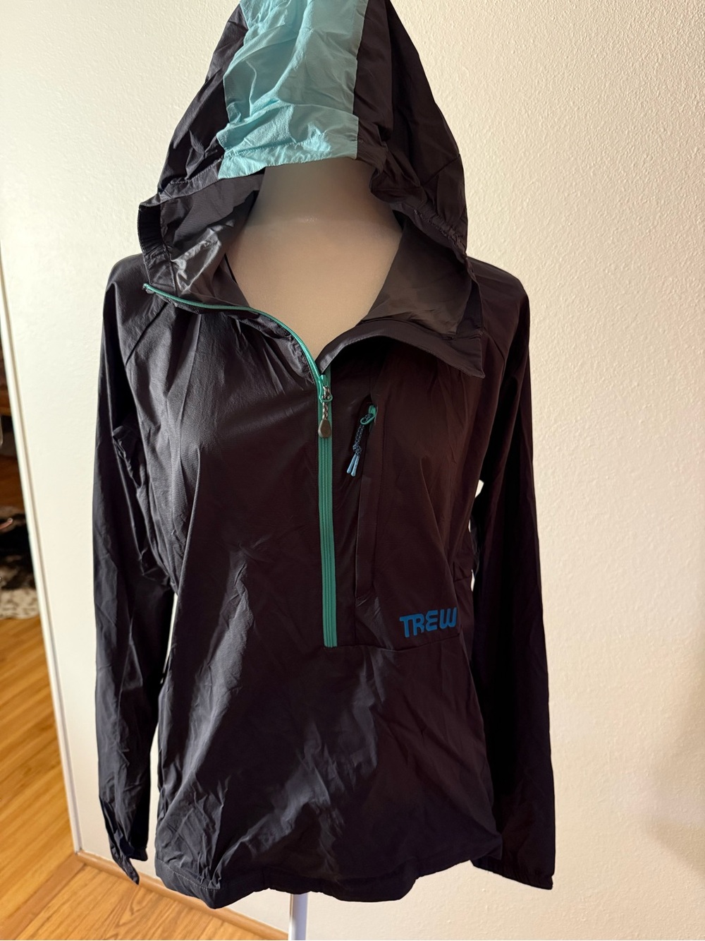 Trew Gear black windbreaker with Teal Hood Lining